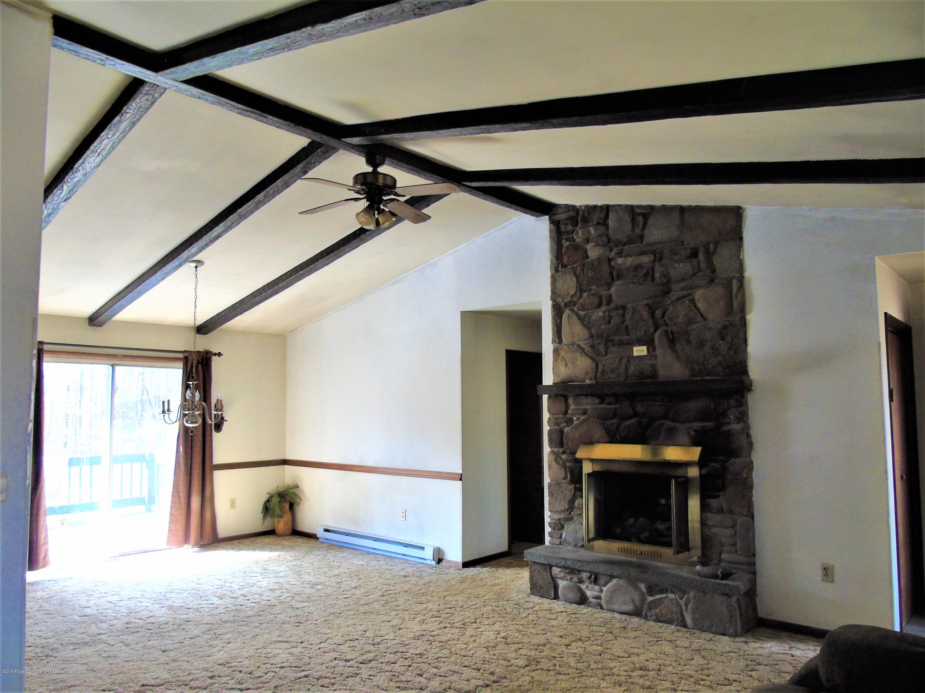 123 Anderson Road Lake Ariel, PA 18436 - Photo 8 of 37 a view of empty room with a fireplace