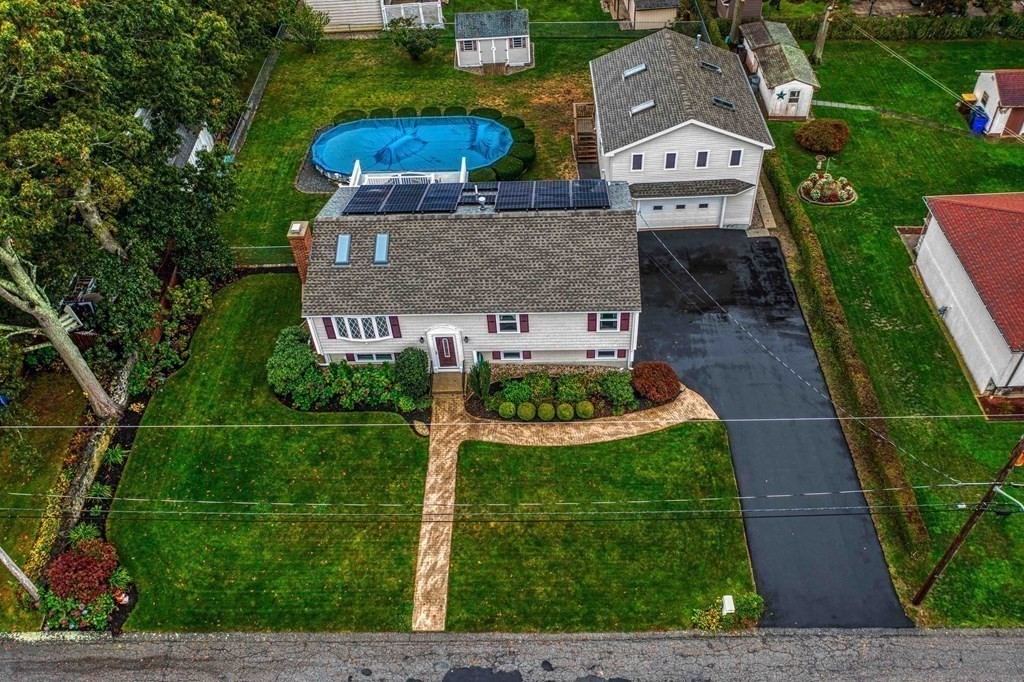 583 Wood Street Fall River, MA 02721 - Photo 2 of 32 a front view of a house with garden