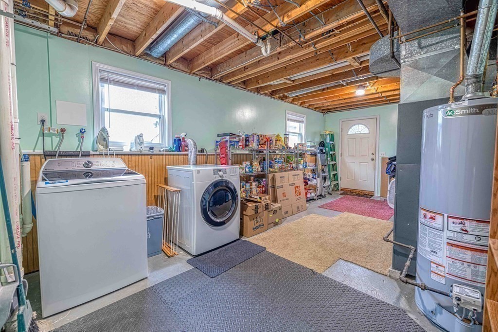 583 Wood Street Fall River, MA 02721 - Photo 22 of 32 a utility room with dryer and washer