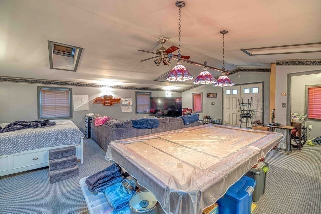 583 Wood Street Fall River, MA 02721 - Photo 26 of 32 a room with pool table and a chandelier
