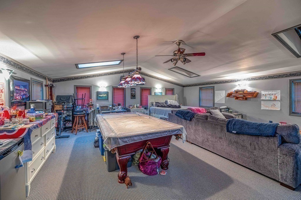 583 Wood Street Fall River, MA 02721 - Photo 27 of 32 a large room with furniture and a large window