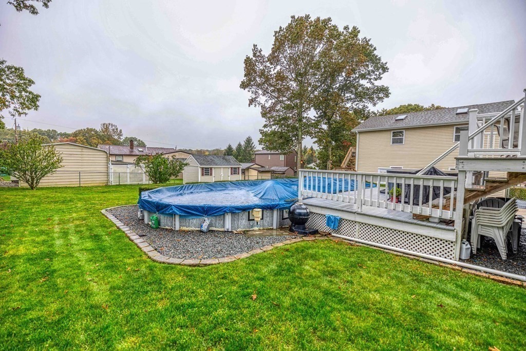 583 Wood Street Fall River, MA 02721 - Photo 28 of 32 a view of a house with backyard and deck