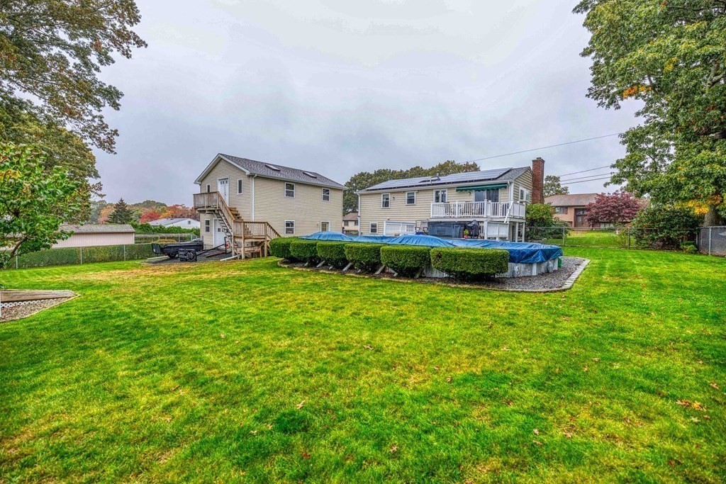 583 Wood Street Fall River, MA 02721 - Photo 29 of 32 a view of a house with a big yard and large trees
