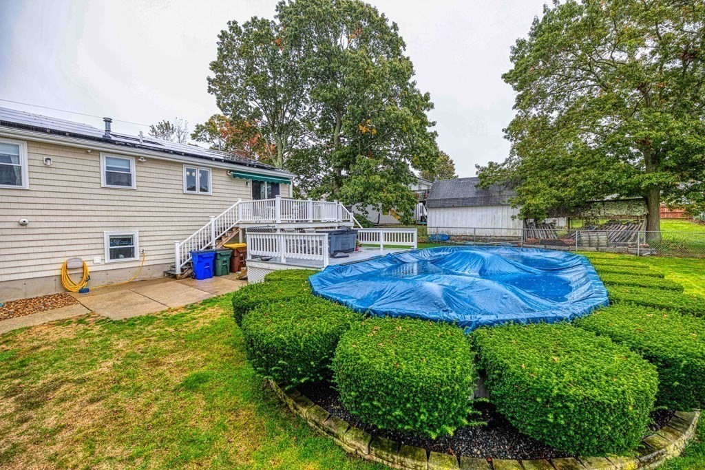 583 Wood Street Fall River, MA 02721 - Photo 30 of 32 a view of a backyard with plants and a patio