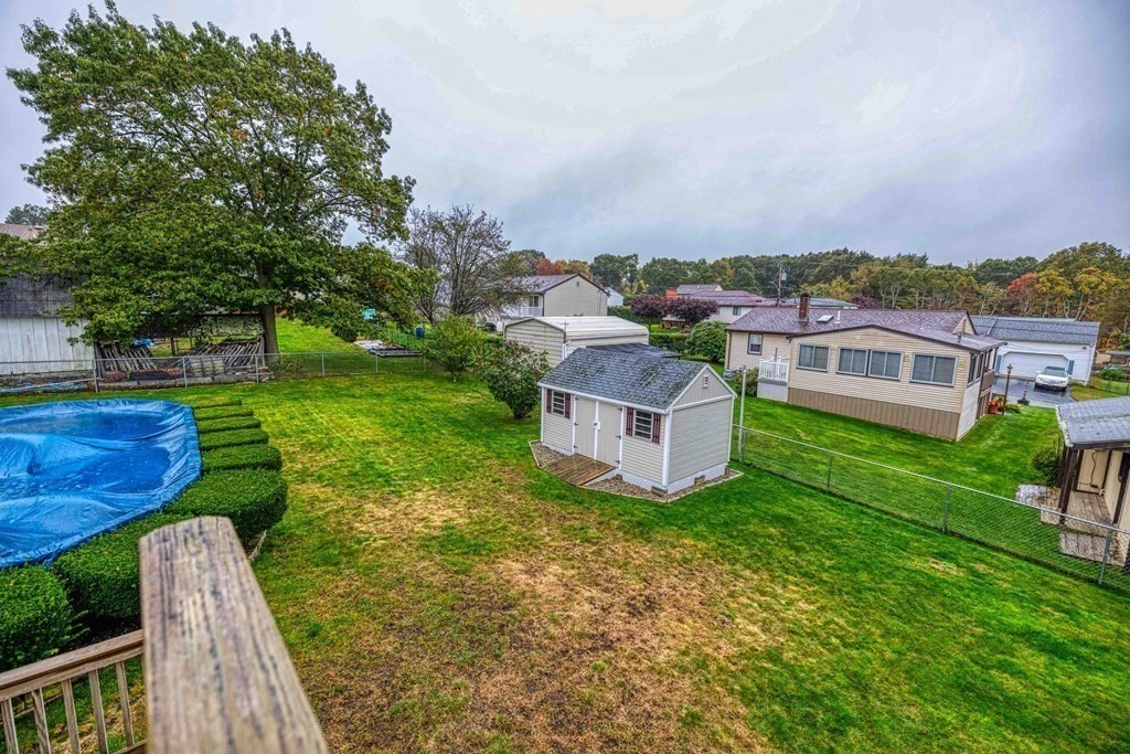 583 Wood Street Fall River, MA 02721 - Photo 31 of 32 a view of a house with a yard and furniture