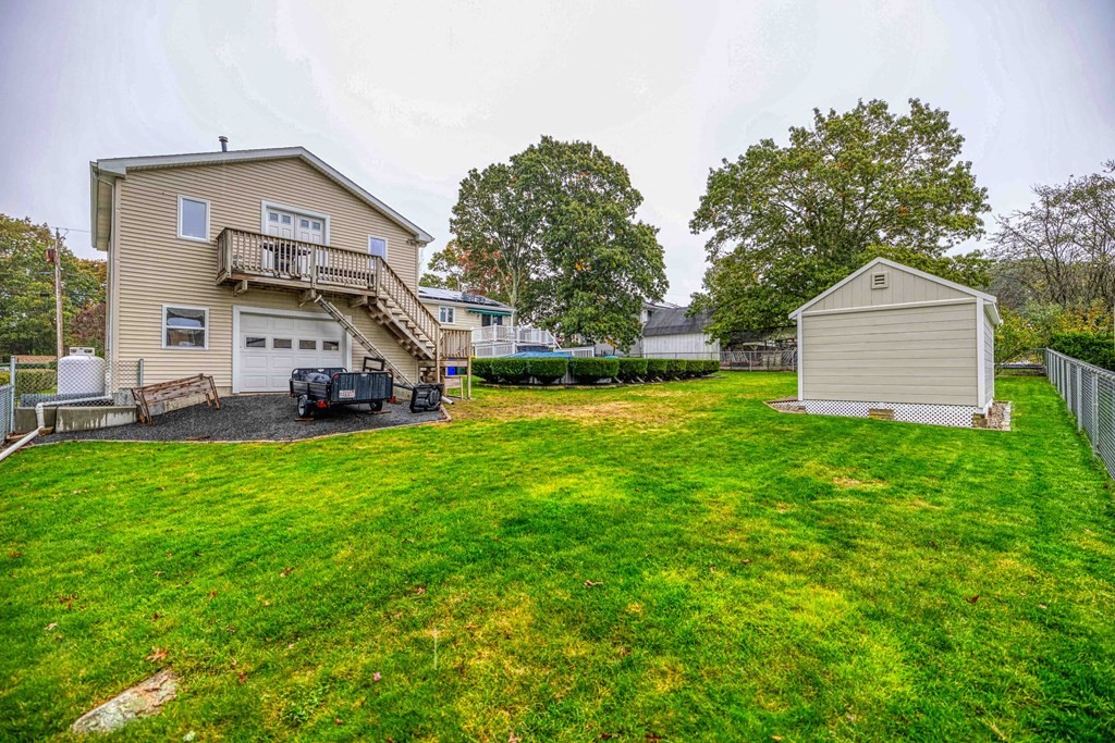 583 Wood Street Fall River, MA 02721 - Photo 32 of 32 a front view of a house with garden