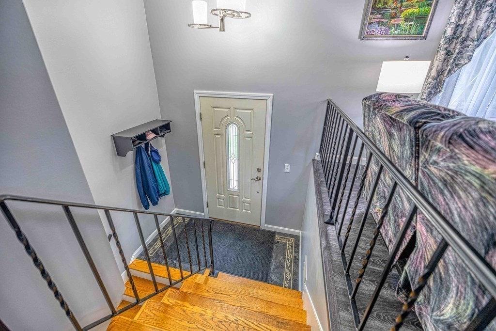 583 Wood Street Fall River, MA 02721 - Photo 6 of 32 a view of an entryway with a staircase