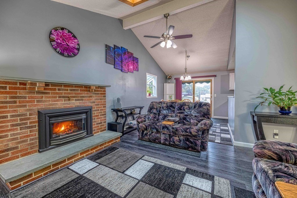 583 Wood Street Fall River, MA 02721 - Photo 7 of 32 a living room with furniture and a fireplace