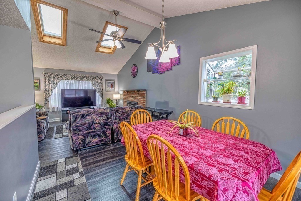 583 Wood Street Fall River, MA 02721 - Photo 9 of 32 a view of a dining room with furniture and a chandelier