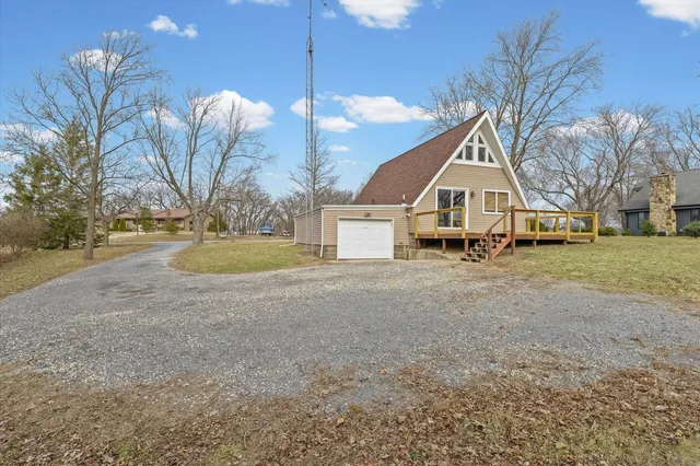 a view of outdoor space with deck and yard