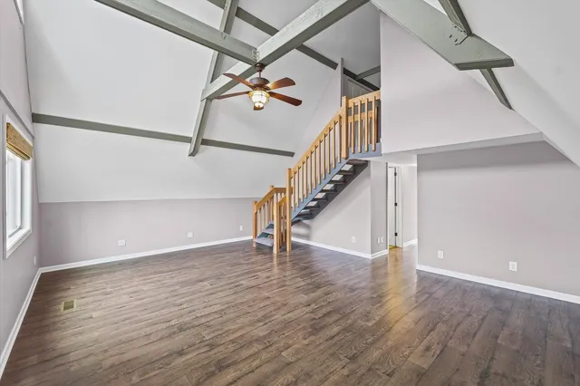 a view of an entryway with wooden floor