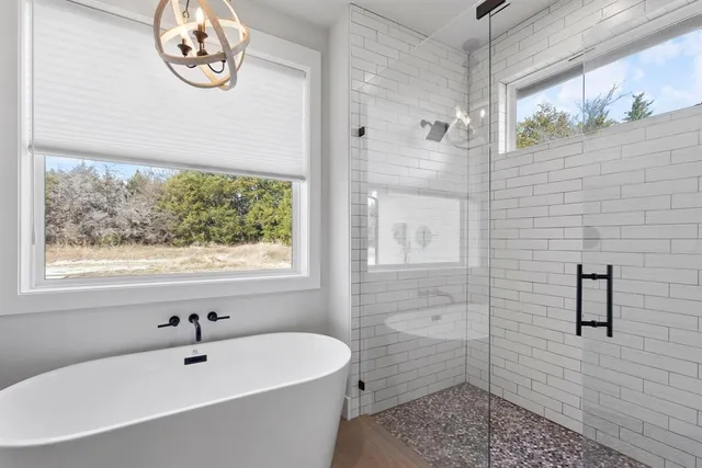 a bathroom with a sink a toilet and a shower