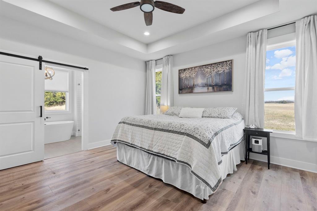 4700 County Road 1040 Celeste, TX 75423 - Photo 22 of 40 a bedroom with a bed and a window