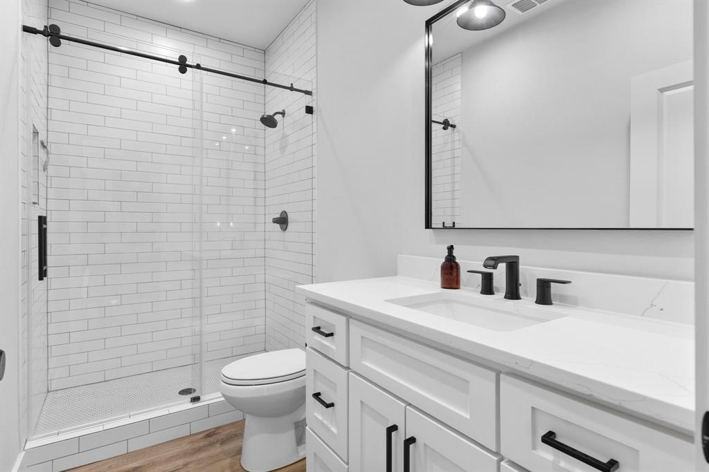 4700 County Road 1040 Celeste, TX 75423 - Photo 24 of 40 a bathroom with a sink a toilet and shower