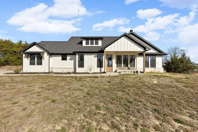 a front view of a house with a porch