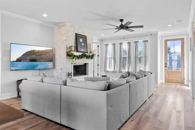 a living room with furniture and a large window