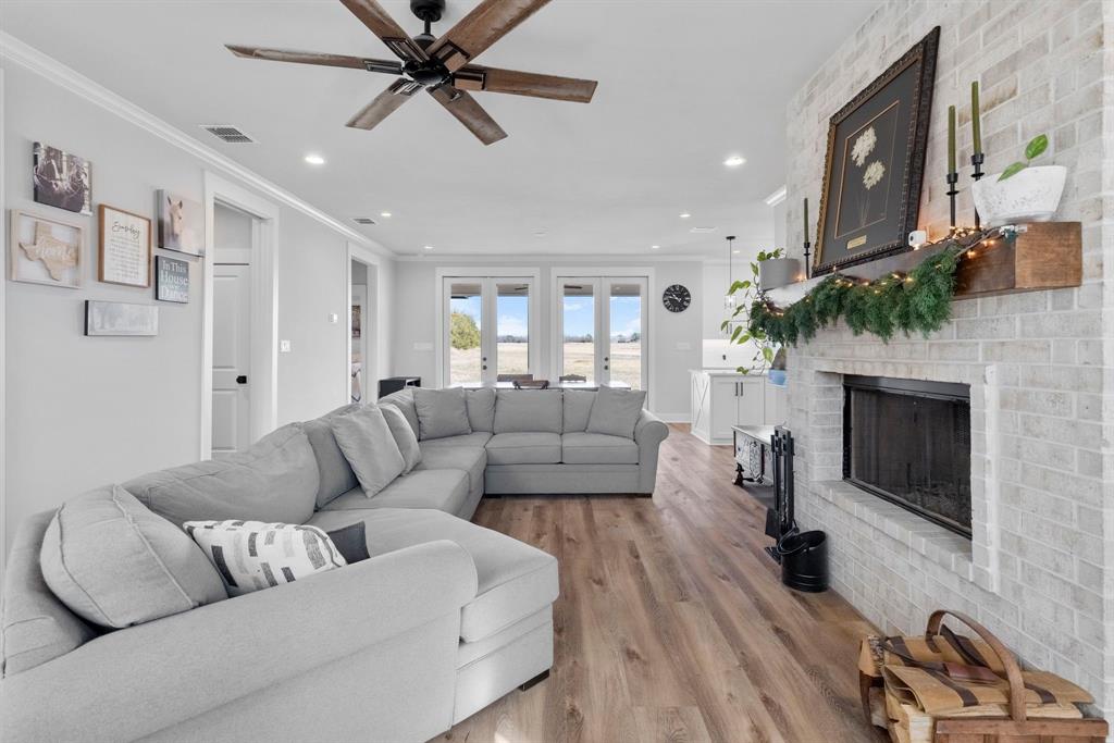 4700 County Road 1040 Celeste, TX 75423 - Photo 8 of 40 a living room with furniture and a fireplace