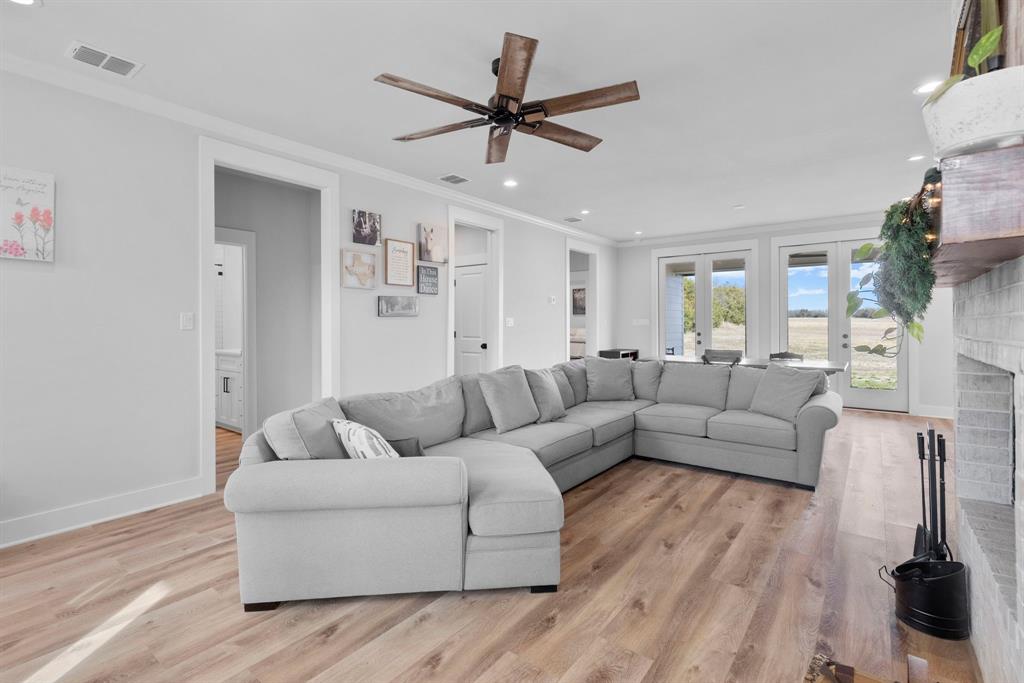 4700 County Road 1040 Celeste, TX 75423 - Photo 9 of 40 a living room with furniture and a wooden floor