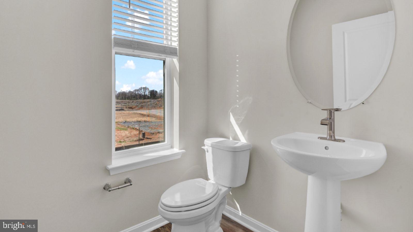 331 Ensemble Way Frederick, MD 21701 - Photo 4 of 27 Main Level Powder Room with Pedestal Sink