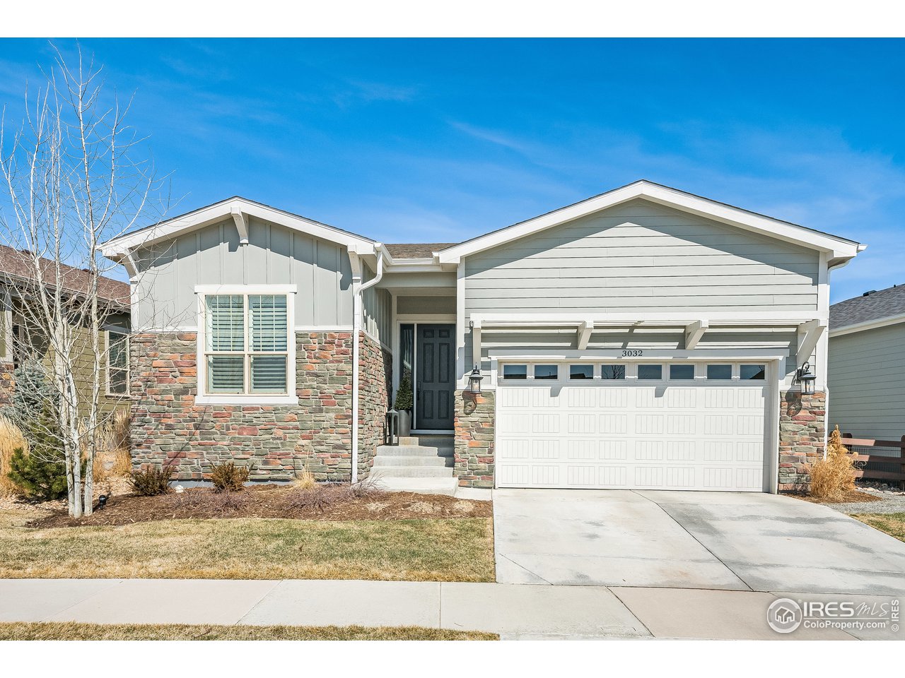 3032 Zephyr Road Fort Collins, CO 80528 - Photo 1 of 34 a front view of a house with a yard