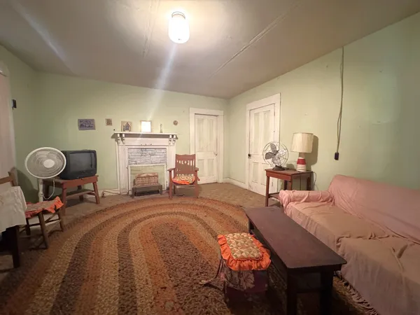 a bed room with a bed window and a chair