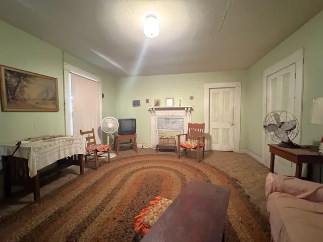 a bed room with a bed and a chair