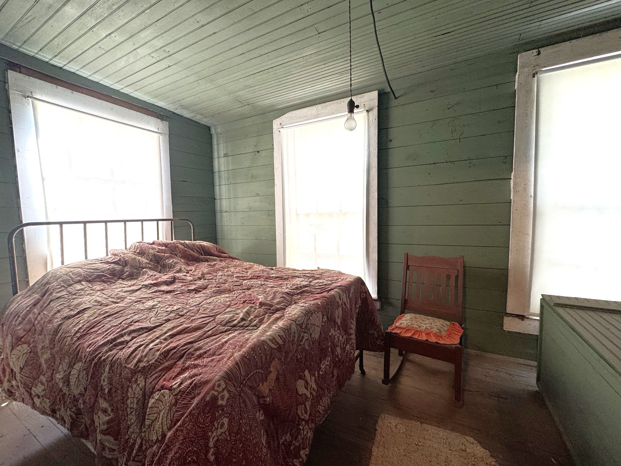 Tbd South Pitzer Street Colmesneil, TX 75938 - Photo 20 of 40 a bedroom with a bed chair and a window