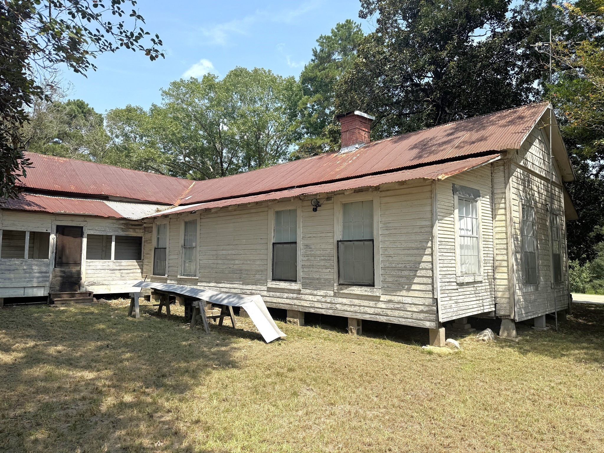 Tbd South Pitzer Street Colmesneil, TX 75938 - Photo 32 of 40 a view of a house with backyard tub and wooden fence
