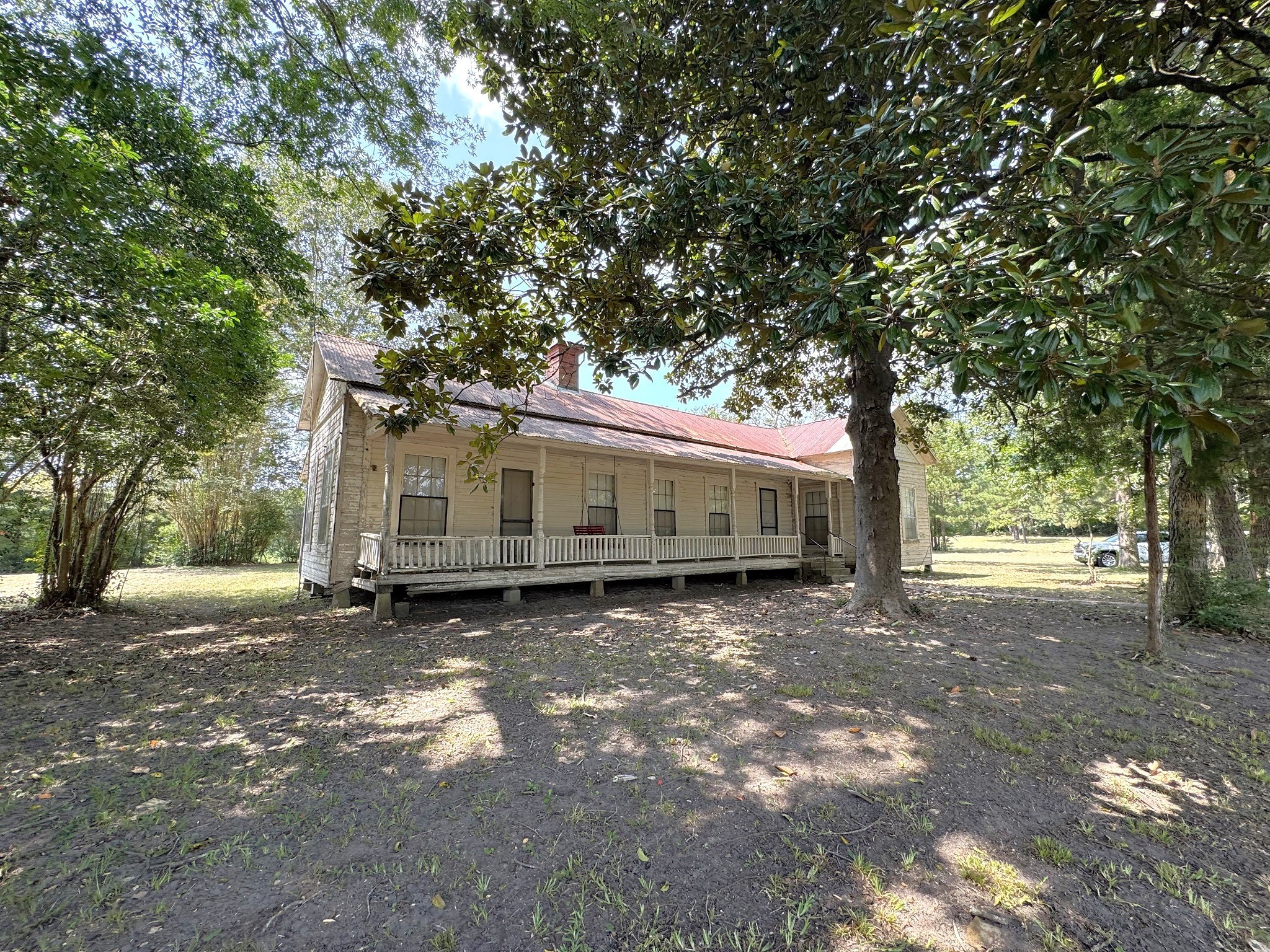 Tbd South Pitzer Street Colmesneil, TX 75938 - Photo 5 of 40 a front view of a house with a garden