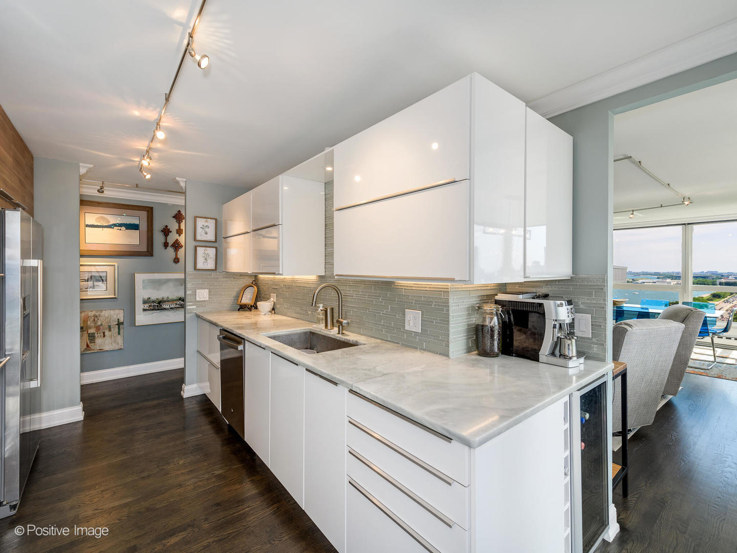 360 East Randolph Street, Unit 2204 Chicago, IL 60601 - Photo 15 of 28 a kitchen with a stove a sink and a refrigerator