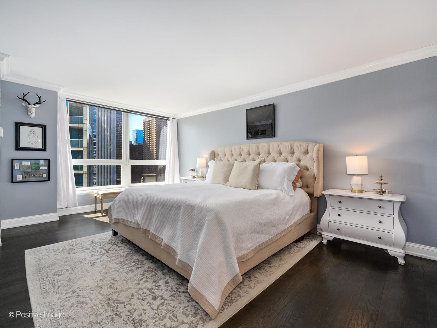 360 East Randolph Street, Unit 2204 Chicago, IL 60601 - Photo 16 of 28 a bed room with a bed and a large window