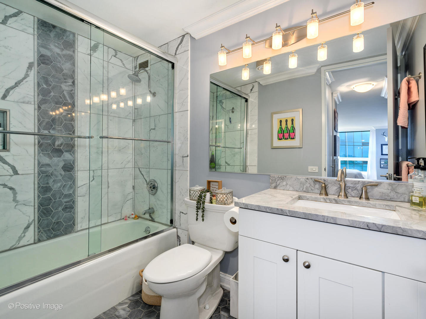 360 East Randolph Street, Unit 2204 Chicago, IL 60601 - Photo 18 of 28 a bathroom with a granite countertop sink toilet mirror and shower