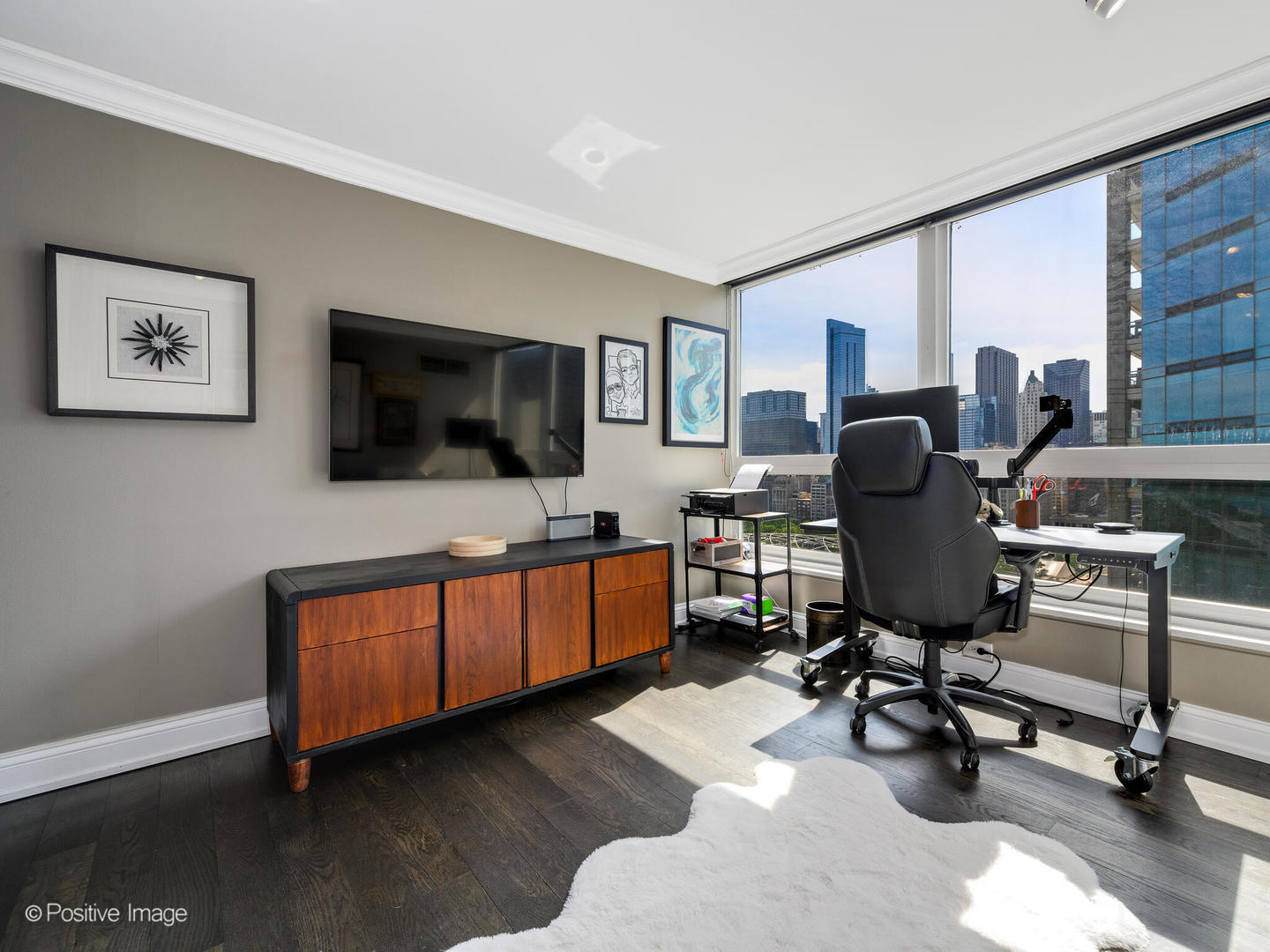360 East Randolph Street, Unit 2204 Chicago, IL 60601 - Photo 19 of 28 a view of a livingroom with workspace and a couch