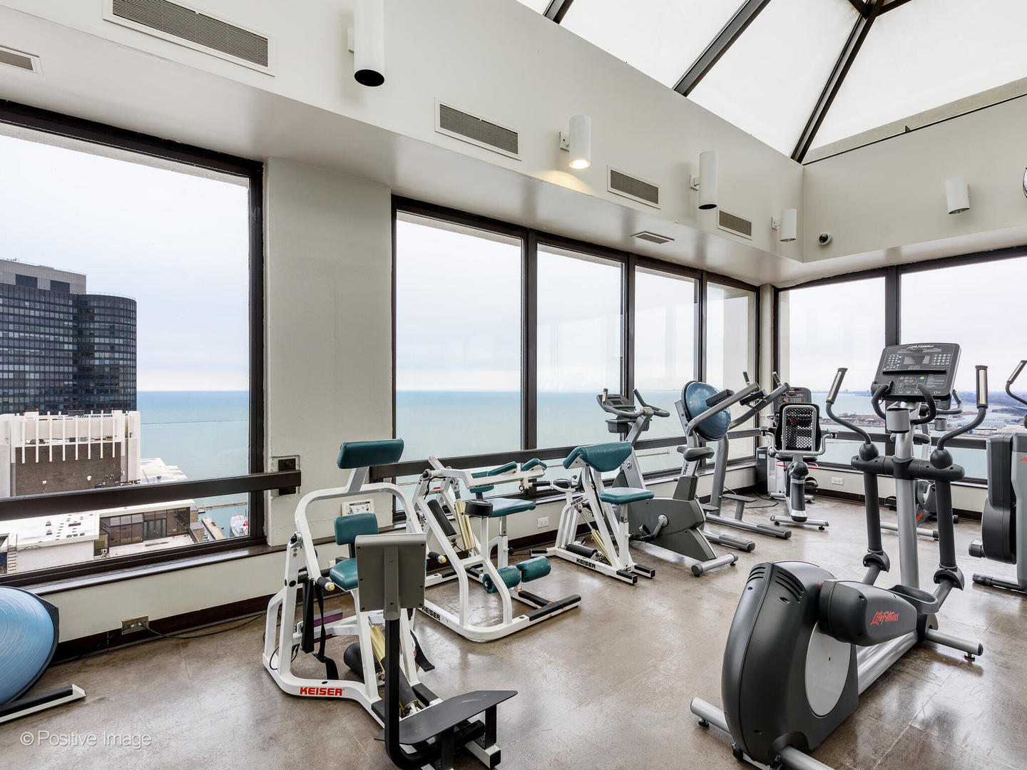 360 East Randolph Street, Unit 2204 Chicago, IL 60601 - Photo 28 of 28 a room with gym equipment and large window
