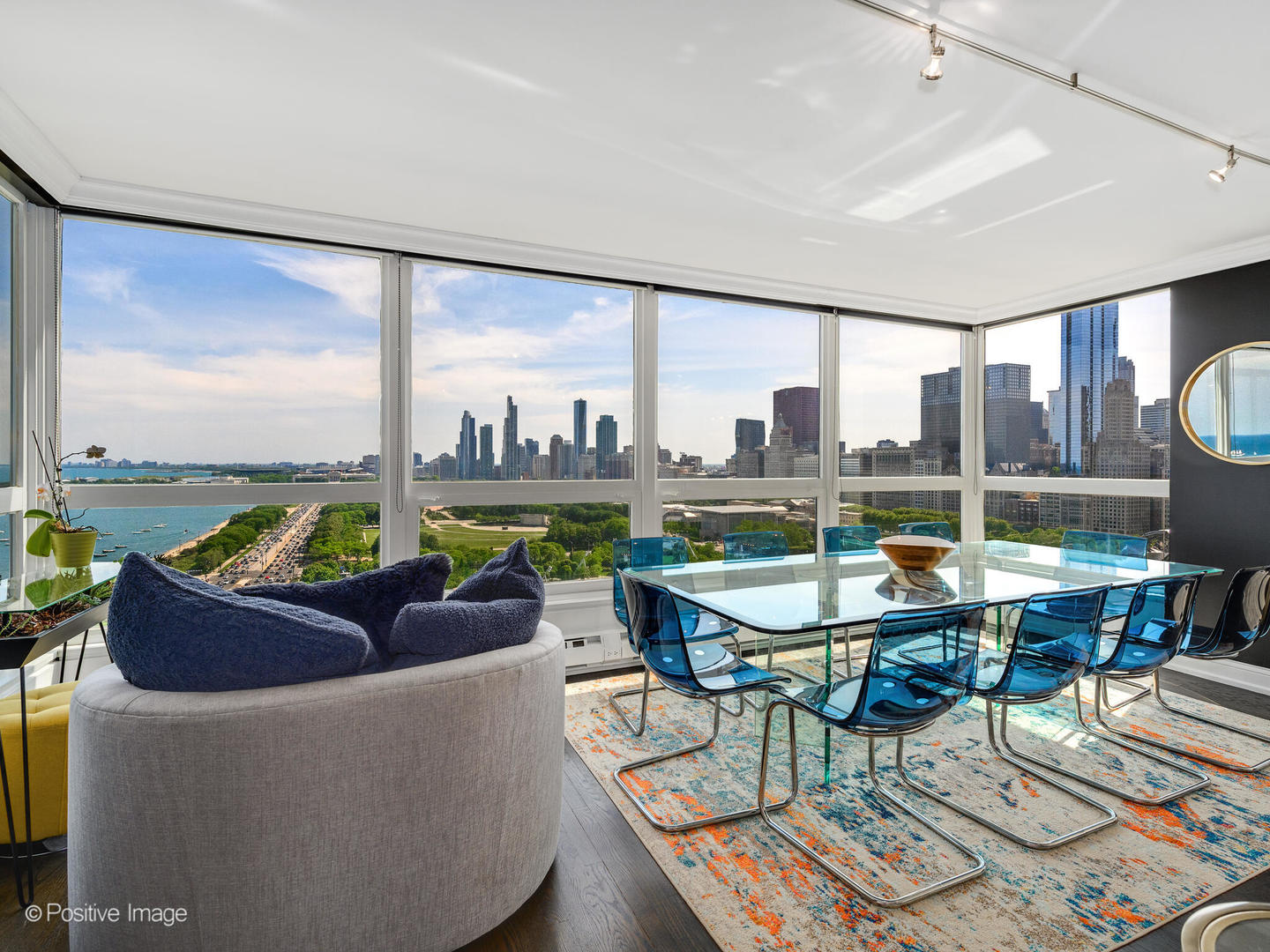 360 East Randolph Street, Unit 2204 Chicago, IL 60601 - Photo 3 of 28 a living room with furniture and a floor to ceiling window