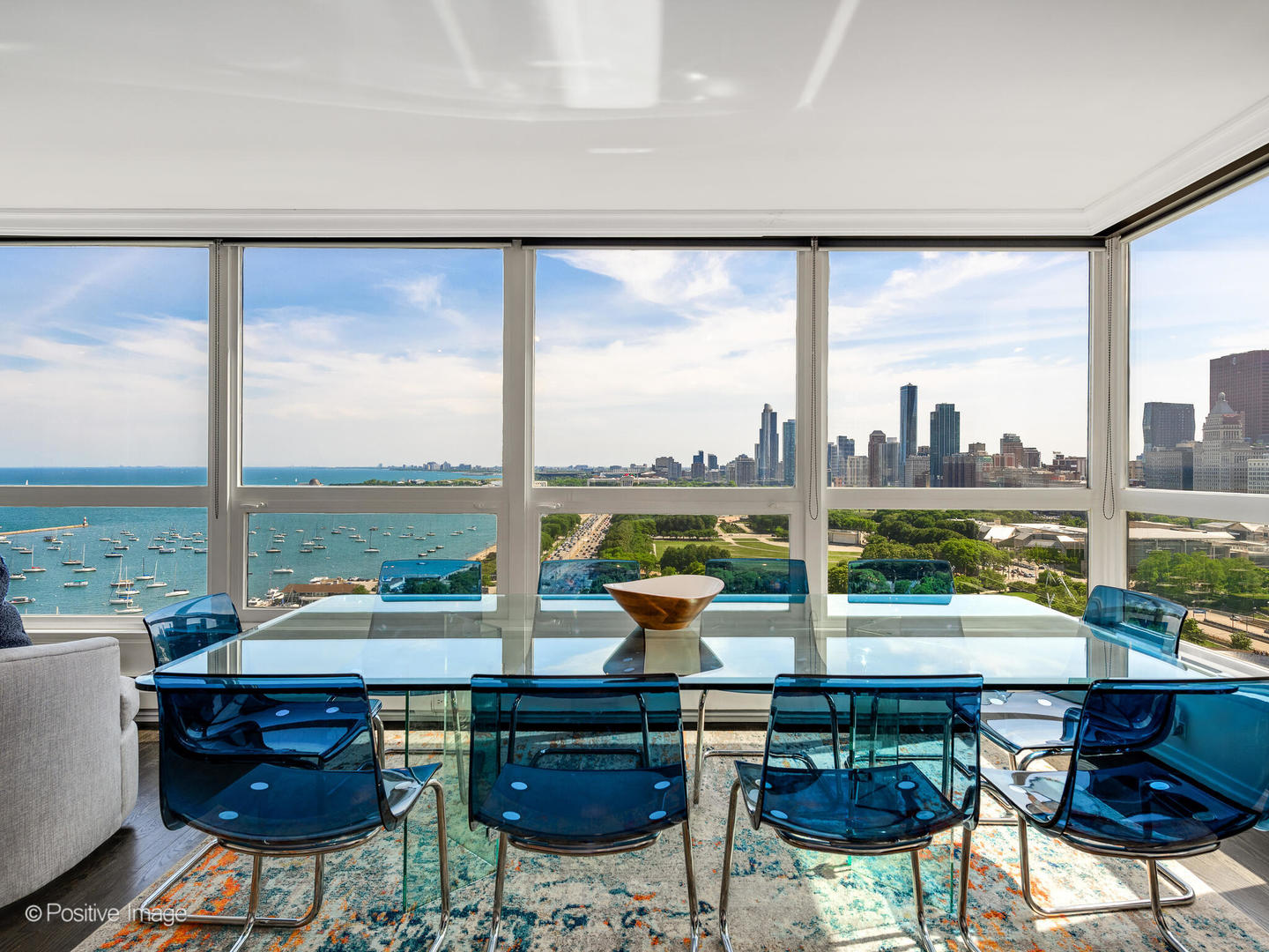 360 East Randolph Street, Unit 2204 Chicago, IL 60601 - Photo 4 of 28 a living room with furniture and a floor to ceiling window