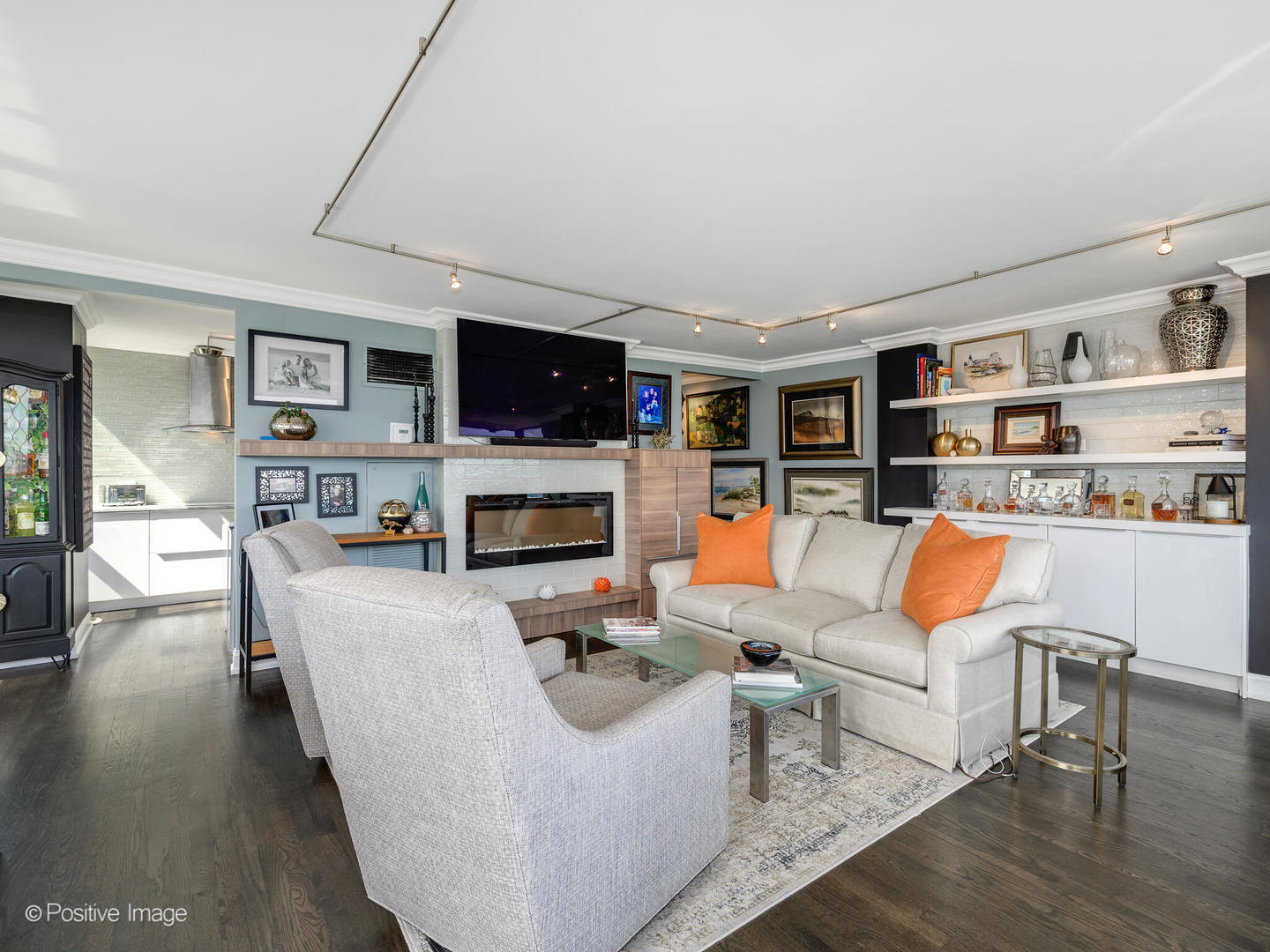 360 East Randolph Street, Unit 2204 Chicago, IL 60601 - Photo 8 of 28 a living room with furniture a fireplace and a flat screen tv