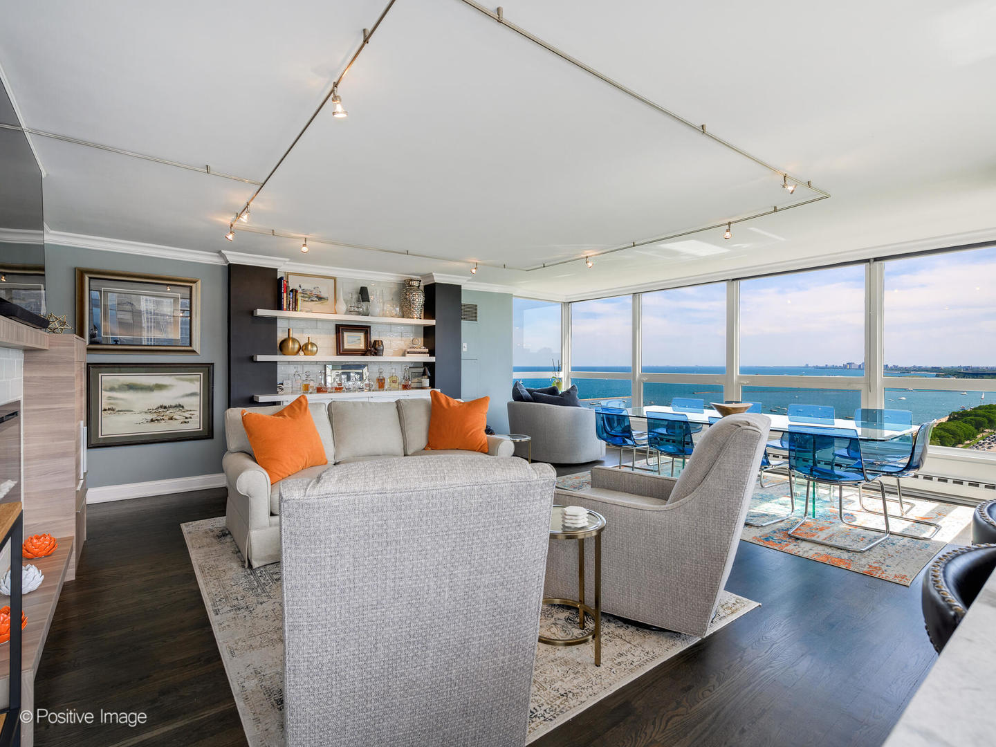 360 East Randolph Street, Unit 2204 Chicago, IL 60601 - Photo 9 of 28 a living room with furniture a large window and a flat screen tv