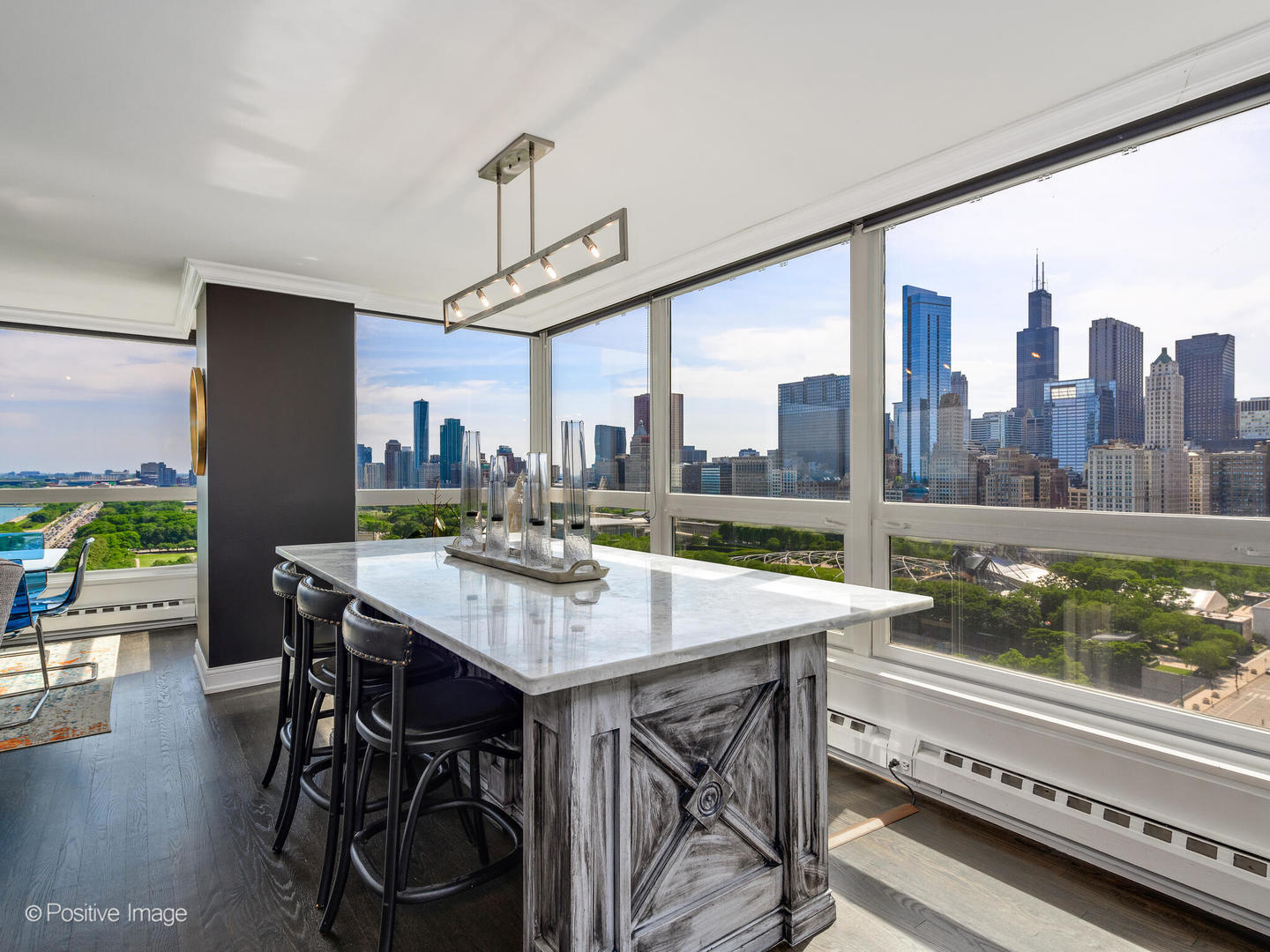 360 East Randolph Street, Unit 2204 Chicago, IL 60601 - Photo 10 of 28 a view of a dining room with furniture window and wooden floor