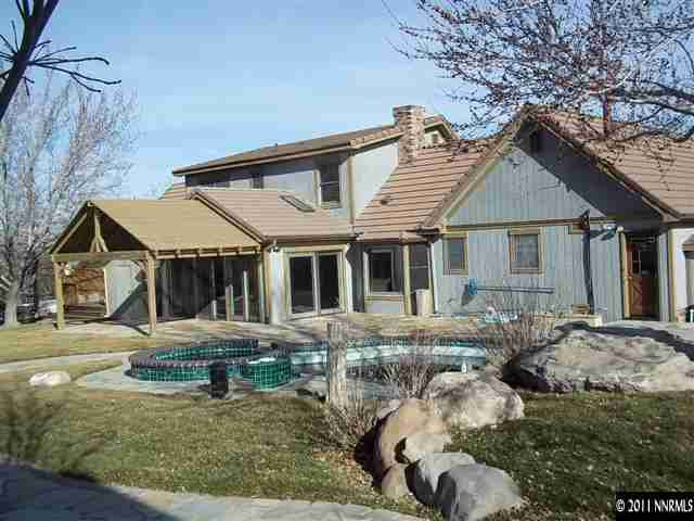 1000 Lampe Road Reno, NV 89511 - Photo 11 of 13 a front view of a house with garden