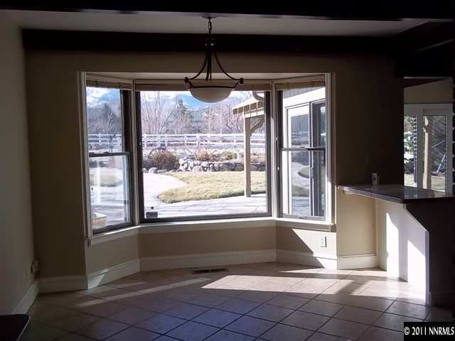 1000 Lampe Road Reno, NV 89511 - Photo 5 of 13 a view of empty room with wooden floor and fan