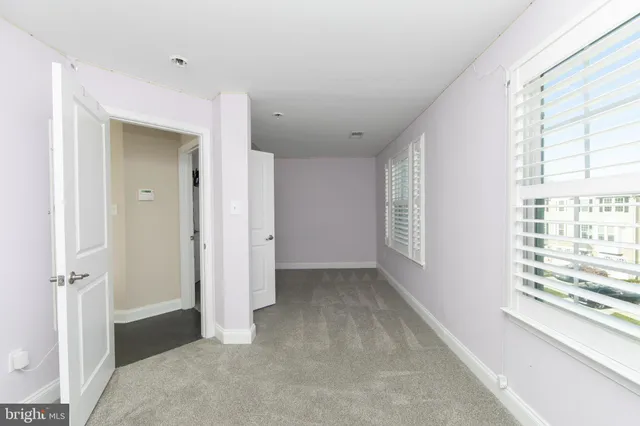 a view of hallway with windows