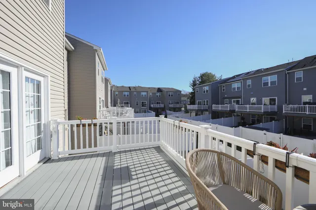 a view of a balcony with wooden floor