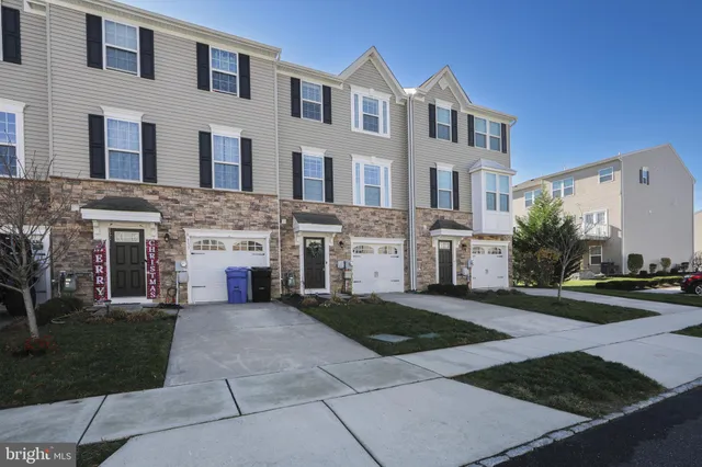 a front view of a house with yard