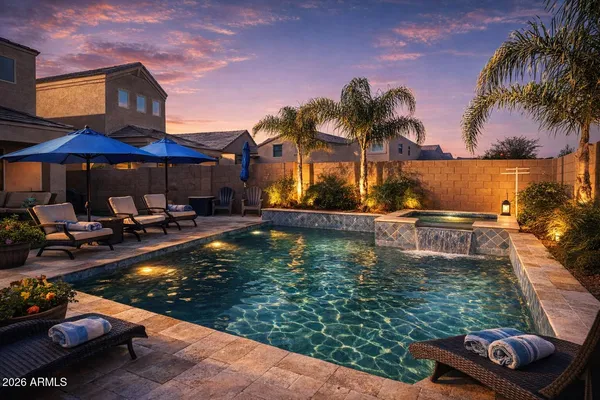 a view of a chairs and table under an umbrella in backyard