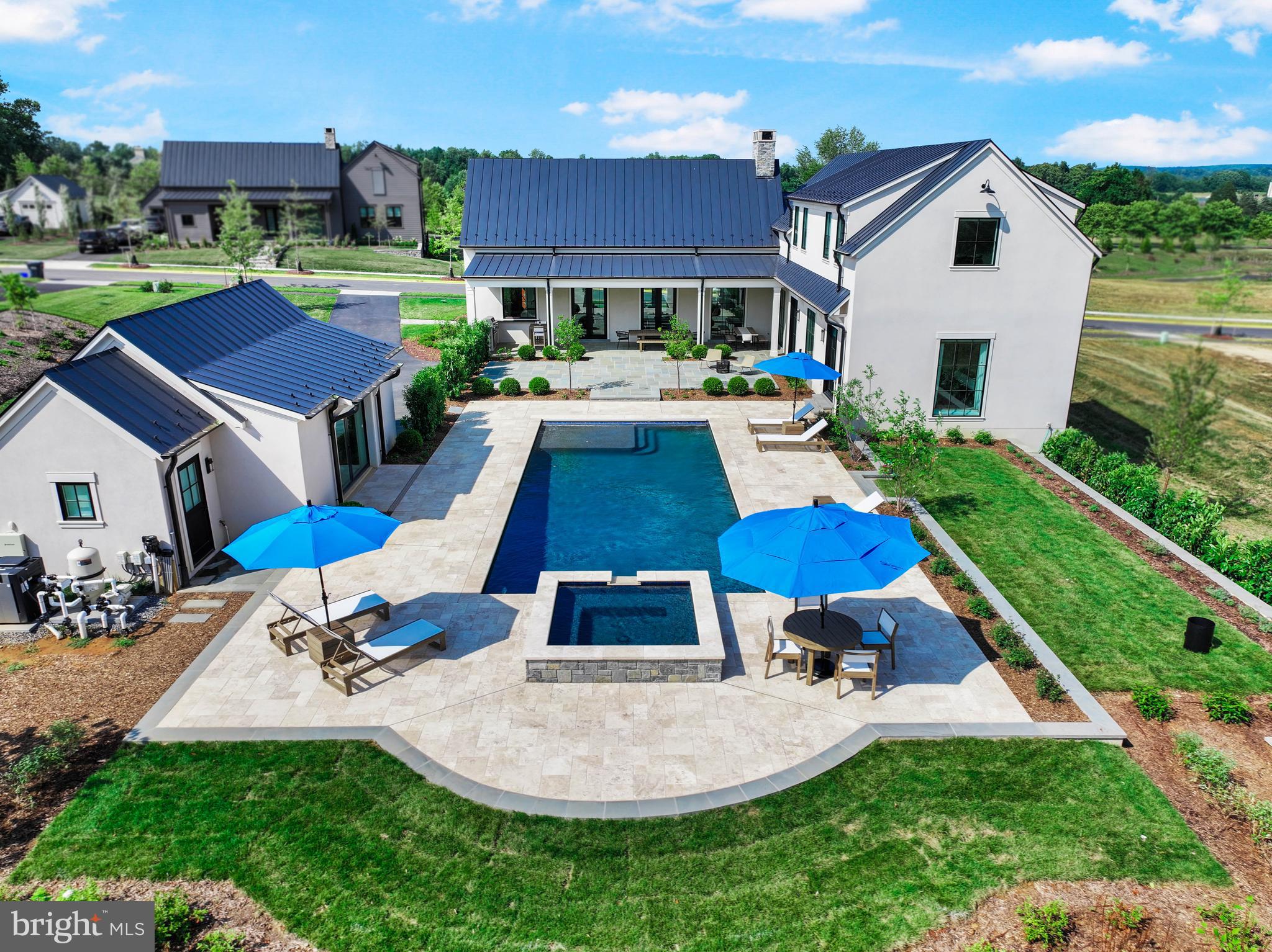 601 Martingale Ridge Drive Middleburg, VA 20117 - Photo 1 of 51 a aerial view of a house with swimming pool and a yard
