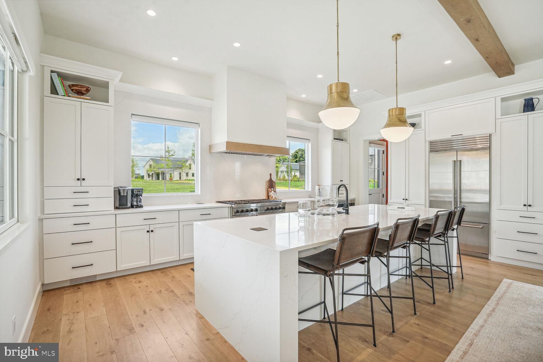 601 Martingale Ridge Drive Middleburg, VA 20117 - Photo 11 of 51 a large kitchen with white cabinets and stainless steel appliances