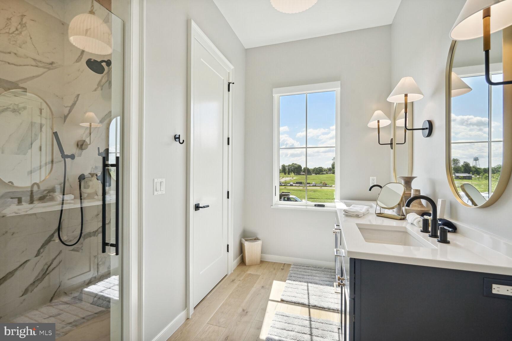 601 Martingale Ridge Drive Middleburg, VA 20117 - Photo 21 of 51 a bathroom with a sink and a mirror