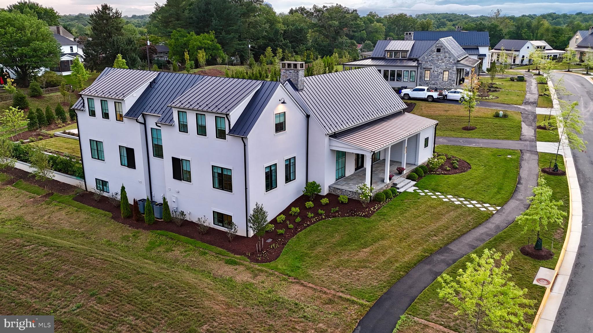 601 Martingale Ridge Drive Middleburg, VA 20117 - Photo 3 of 51 an aerial view of multiple houses with a yard