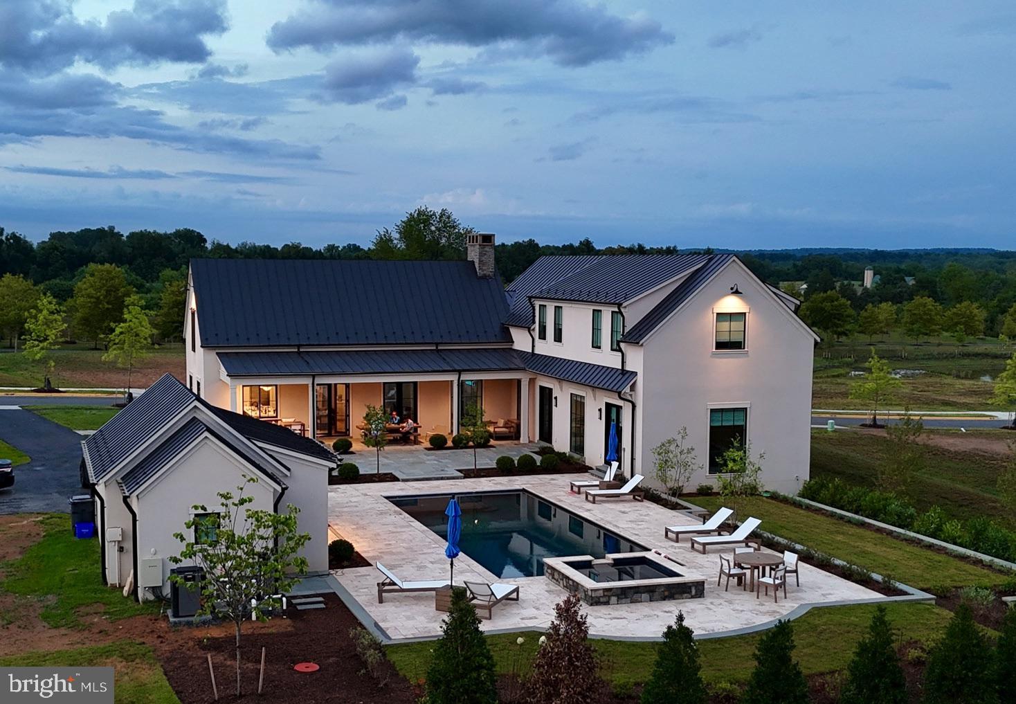 601 Martingale Ridge Drive Middleburg, VA 20117 - Photo 36 of 51 an aerial view of a house with swimming pool and garden view